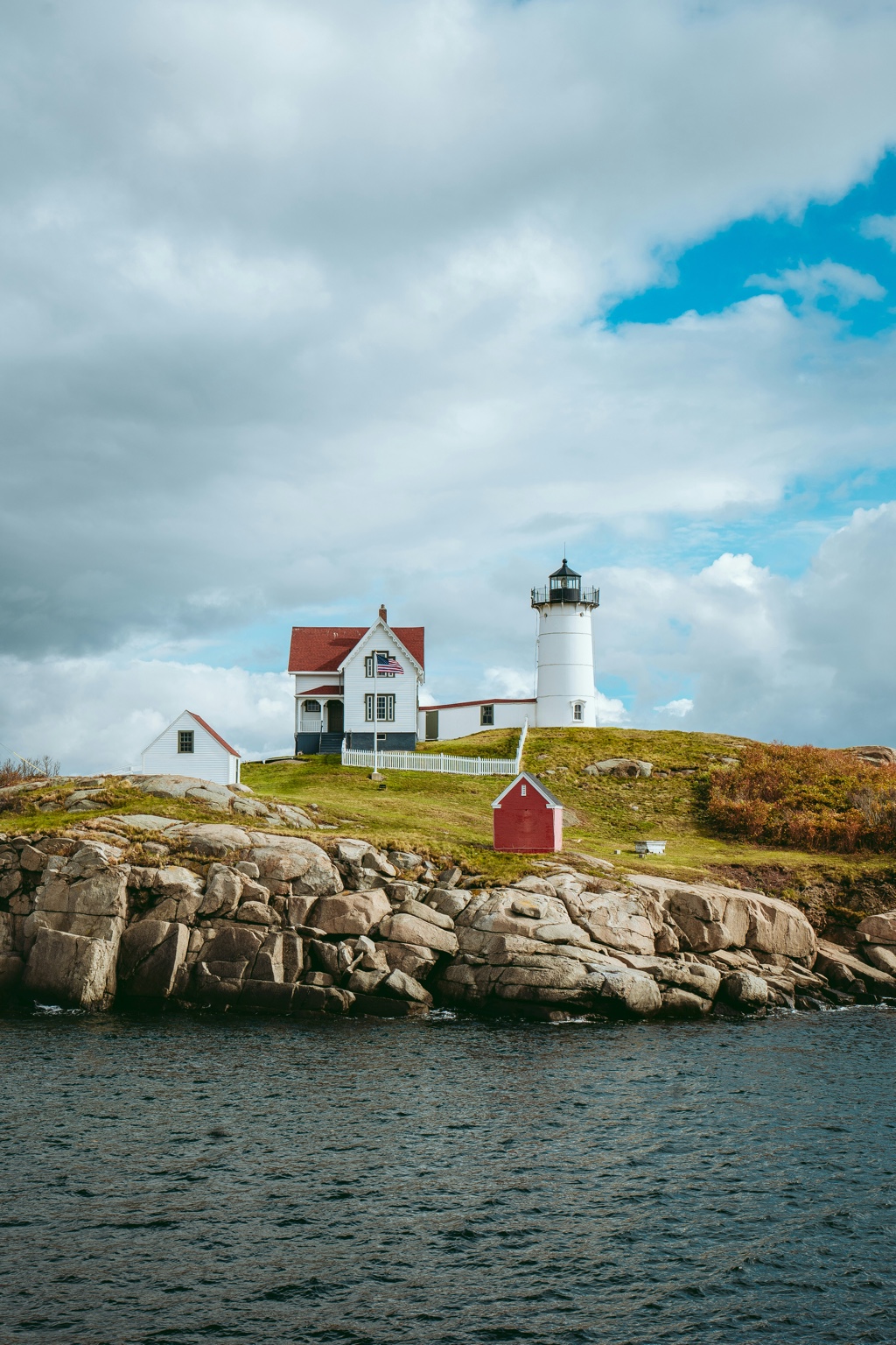 Nubble Lighthouse in York, Southern Maine, overlooking rocky Atlantic coastline